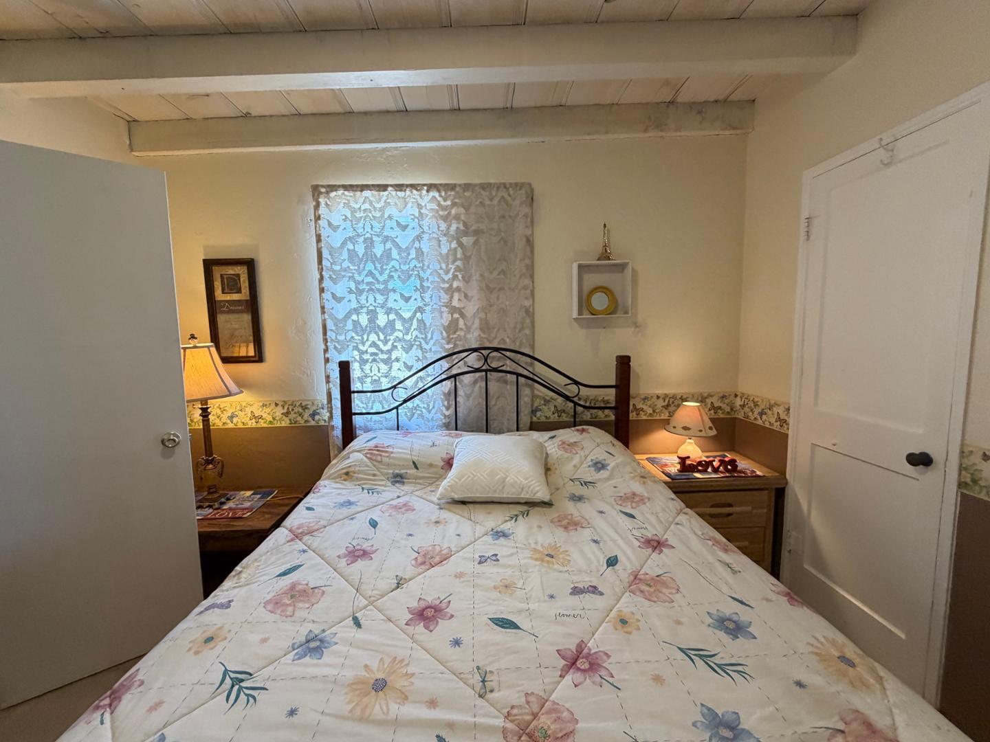 9502 North 2nd Place Phoenix, AZ 85020 - Photo 10 of 21 a bedroom with a bed and window