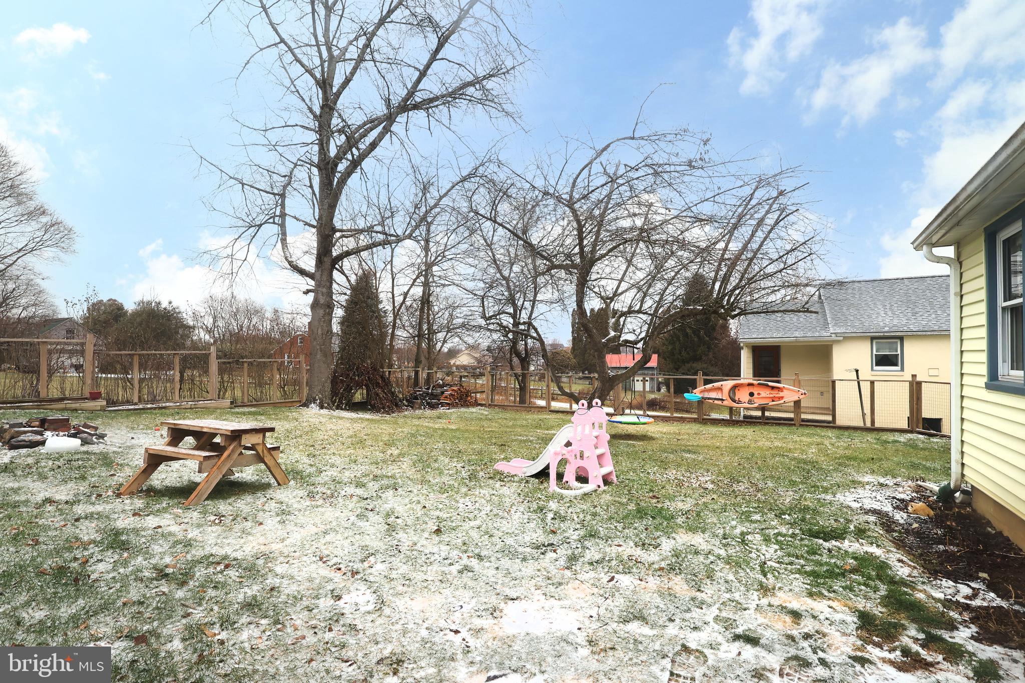 746 South Nixon Road Pine Grove Mills, PA 16868 - Photo 33 of 38 a backyard of a house with fire pit and chairs