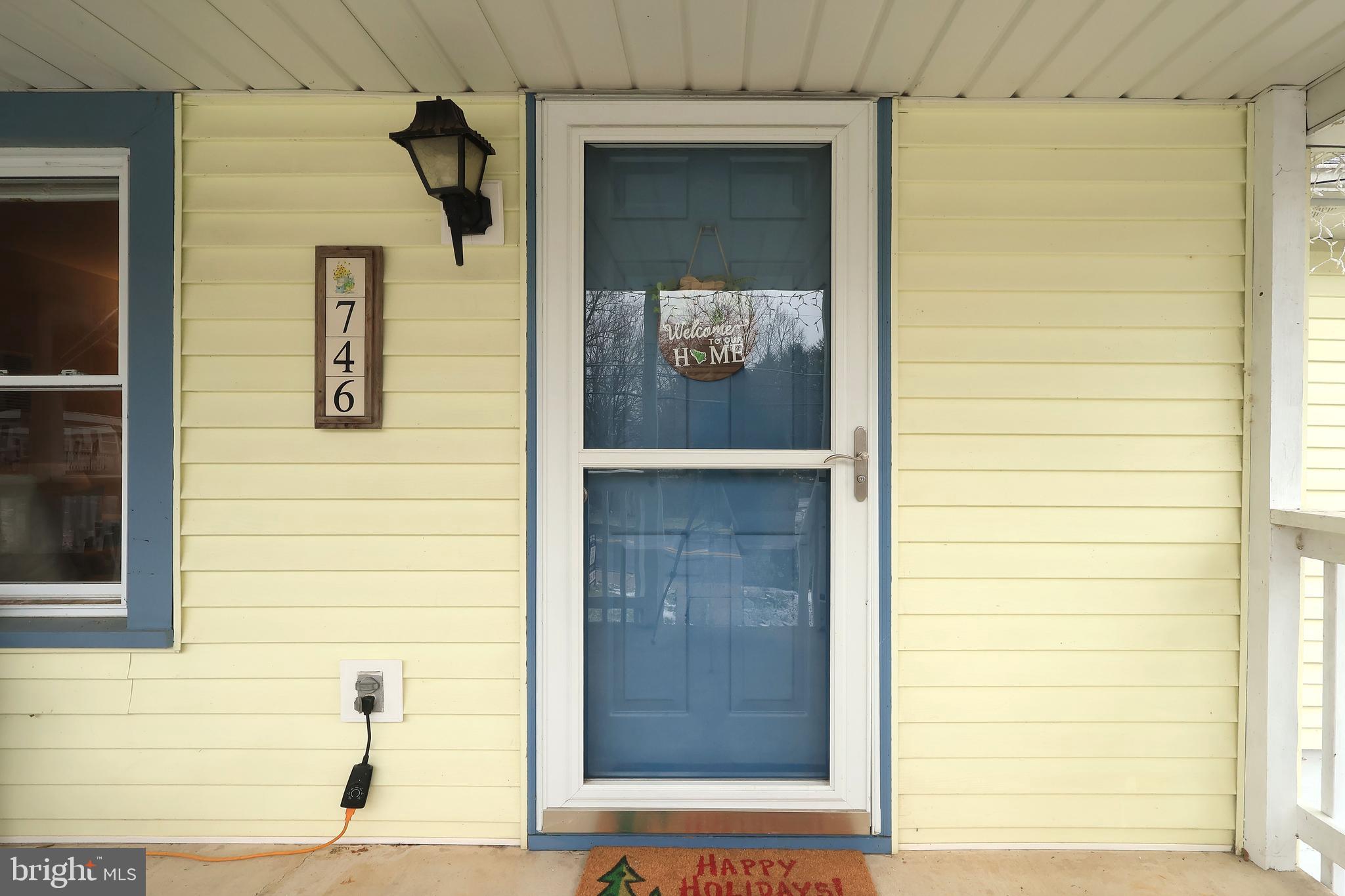746 South Nixon Road Pine Grove Mills, PA 16868 - Photo 6 of 38 a view of front door and wooden door