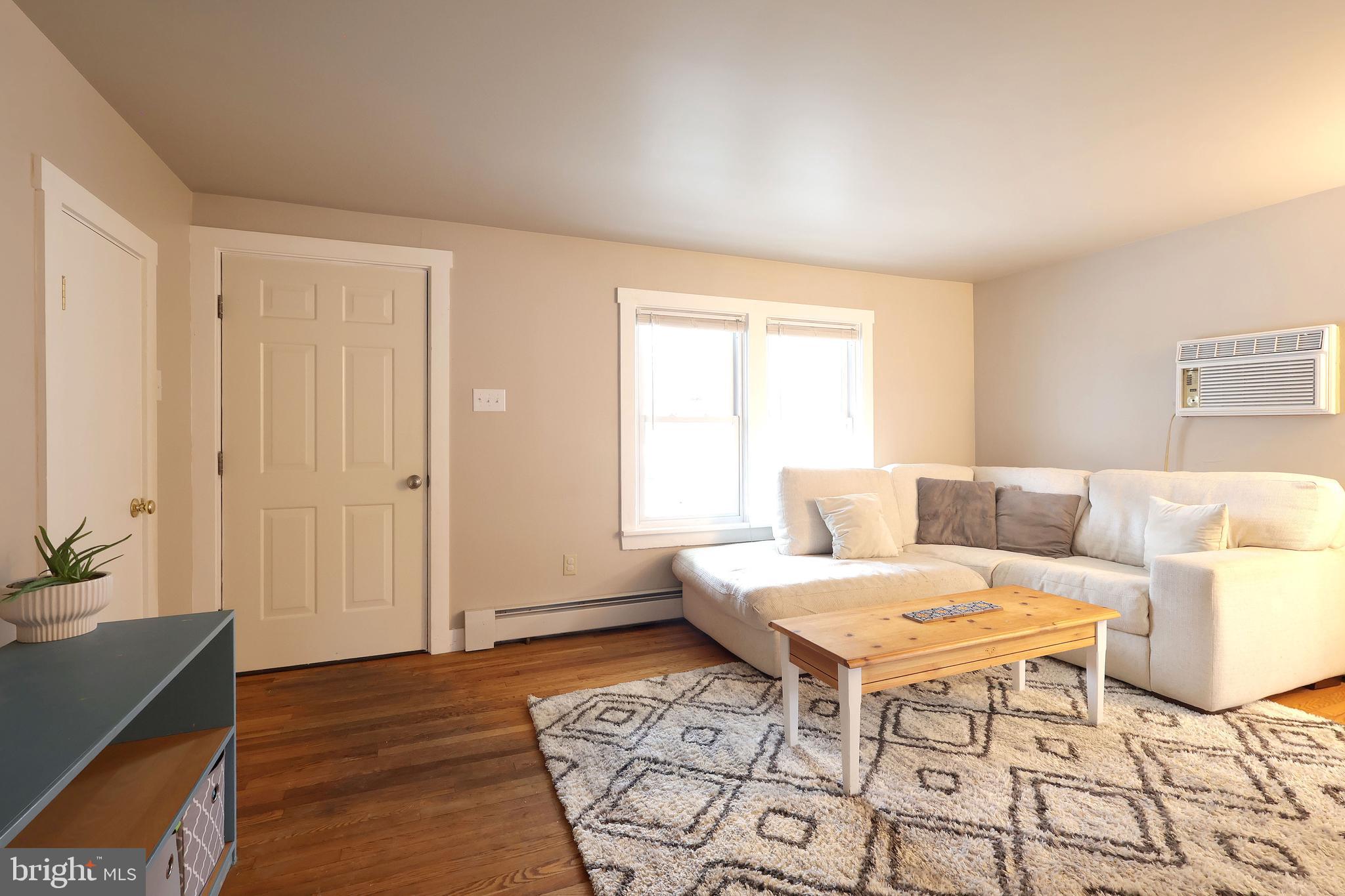 746 South Nixon Road Pine Grove Mills, PA 16868 - Photo 8 of 38 a living room with furniture and wooden floor