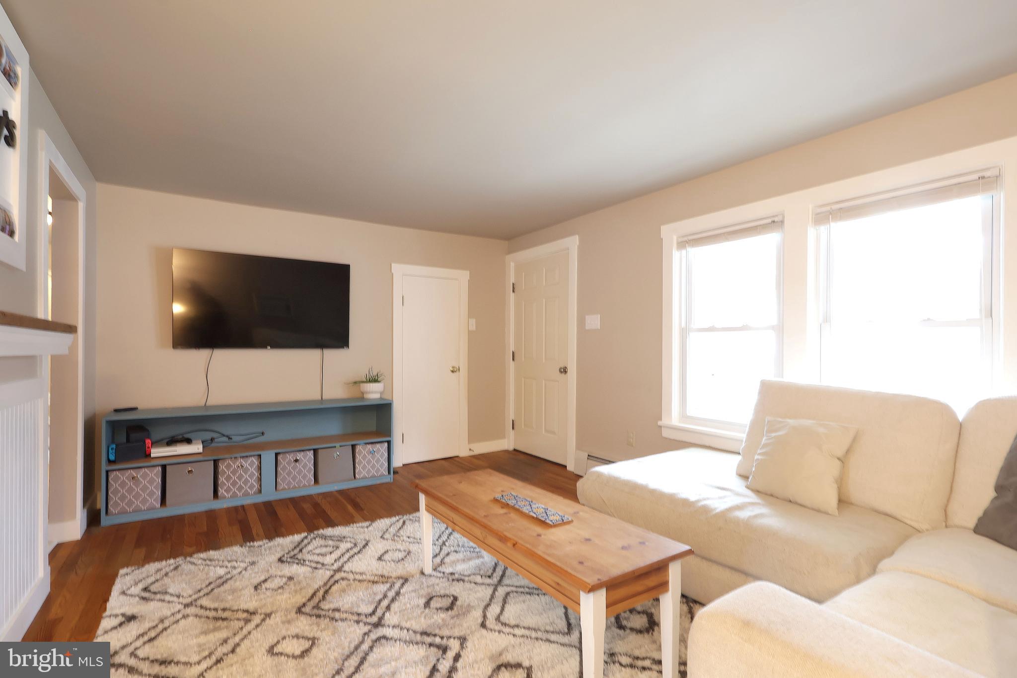 746 South Nixon Road Pine Grove Mills, PA 16868 - Photo 9 of 38 a living room with a flat screen tv and a couch