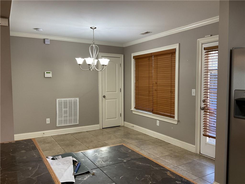 10 Sarah Street Northwest Rome, GA 30165 - Photo 7 of 14 a view of a livingroom with a chandelier fan and windows