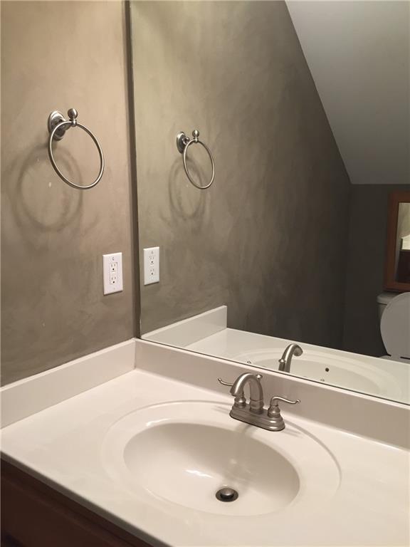 10 Sarah Street Northwest Rome, GA 30165 - Photo 8 of 14 a bathroom with a sink and a mirror