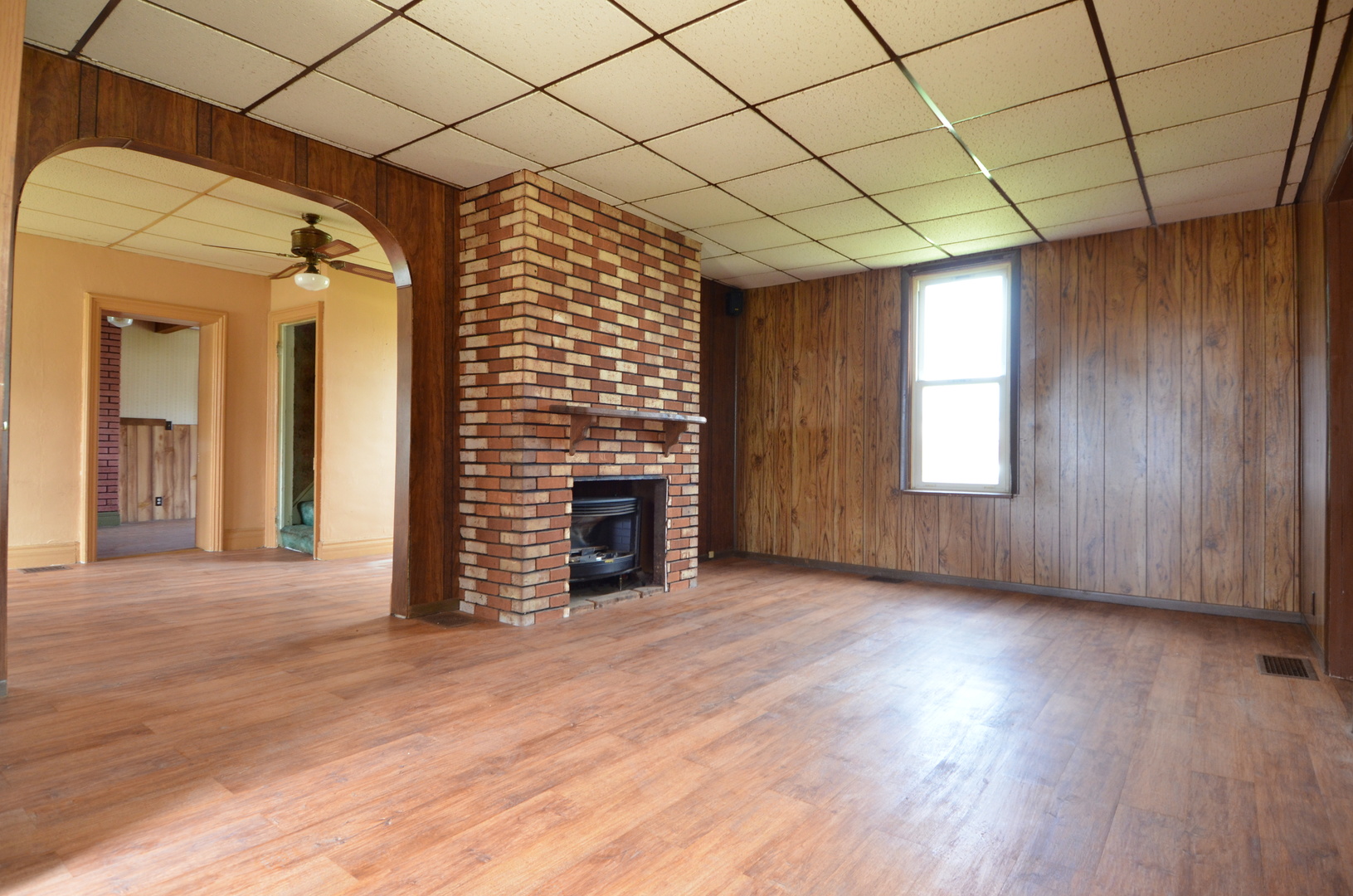 103 North Lane Street Ransom, IL 60470 - Photo 2 of 14 an empty room with wooden floor and windows