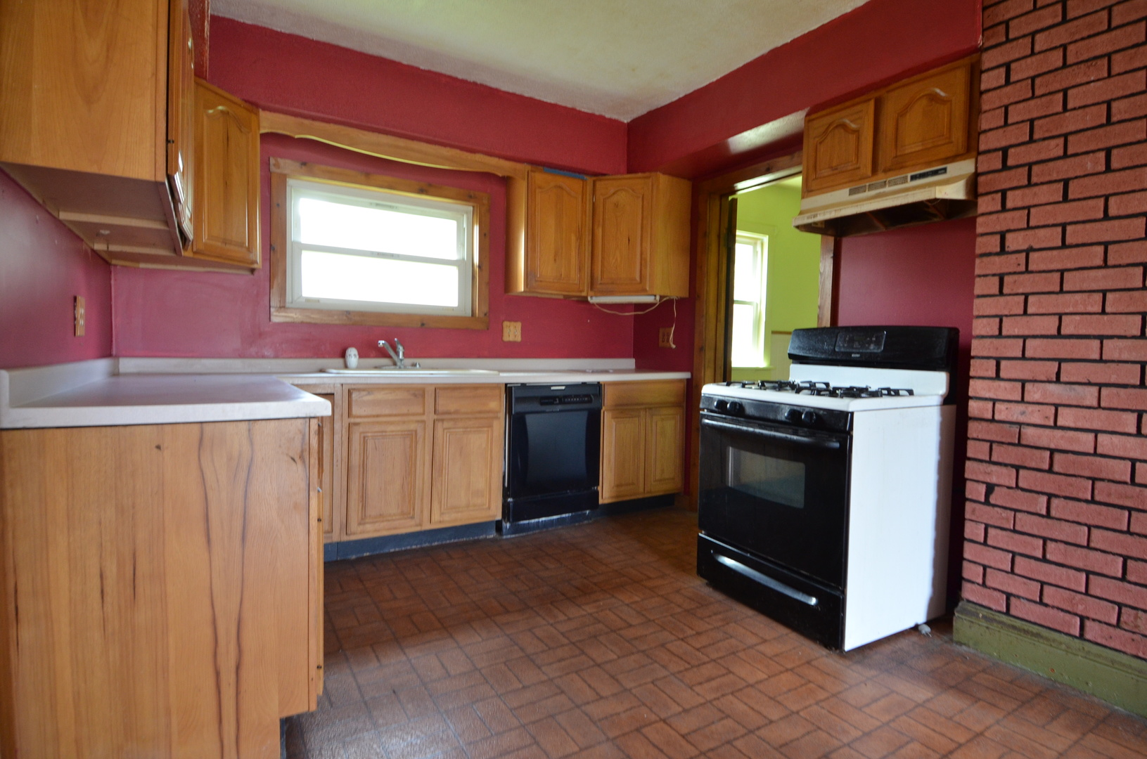 103 North Lane Street Ransom, IL 60470 - Photo 5 of 14 a kitchen with a stove top oven sink and cabinets