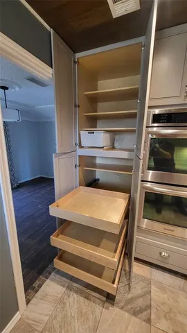 a stove top oven sitting inside of a kitchen