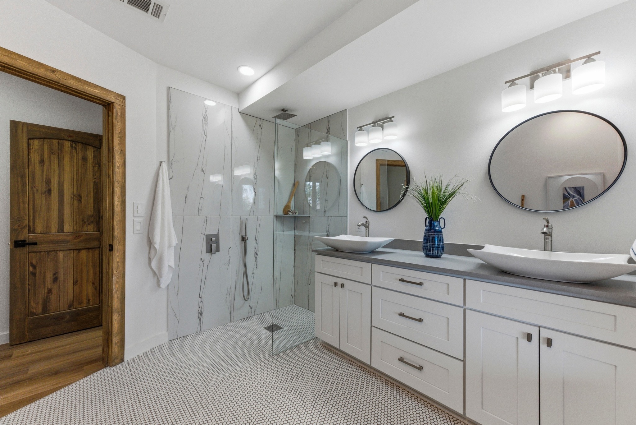 2649 Crazyhorse Pass Austin, TX 78734 - Photo 18 of 40 Primary Bathroom featuring a marble finish shower, double vanity, and recessed lighting