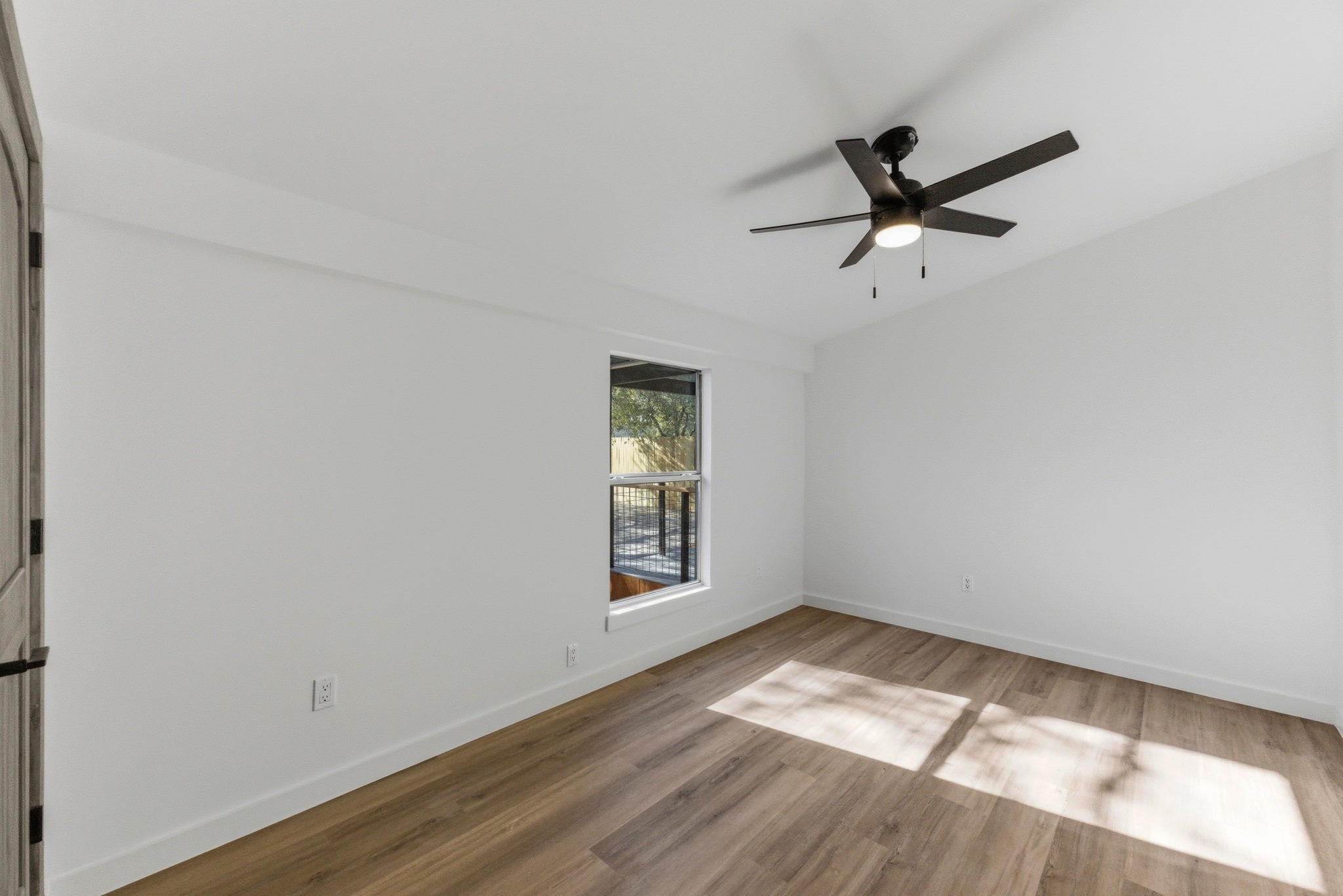 2649 Crazyhorse Pass Austin, TX 78734 - Photo 20 of 40 Large front bedroom featuring light wood-style flooring and a ceiling fan