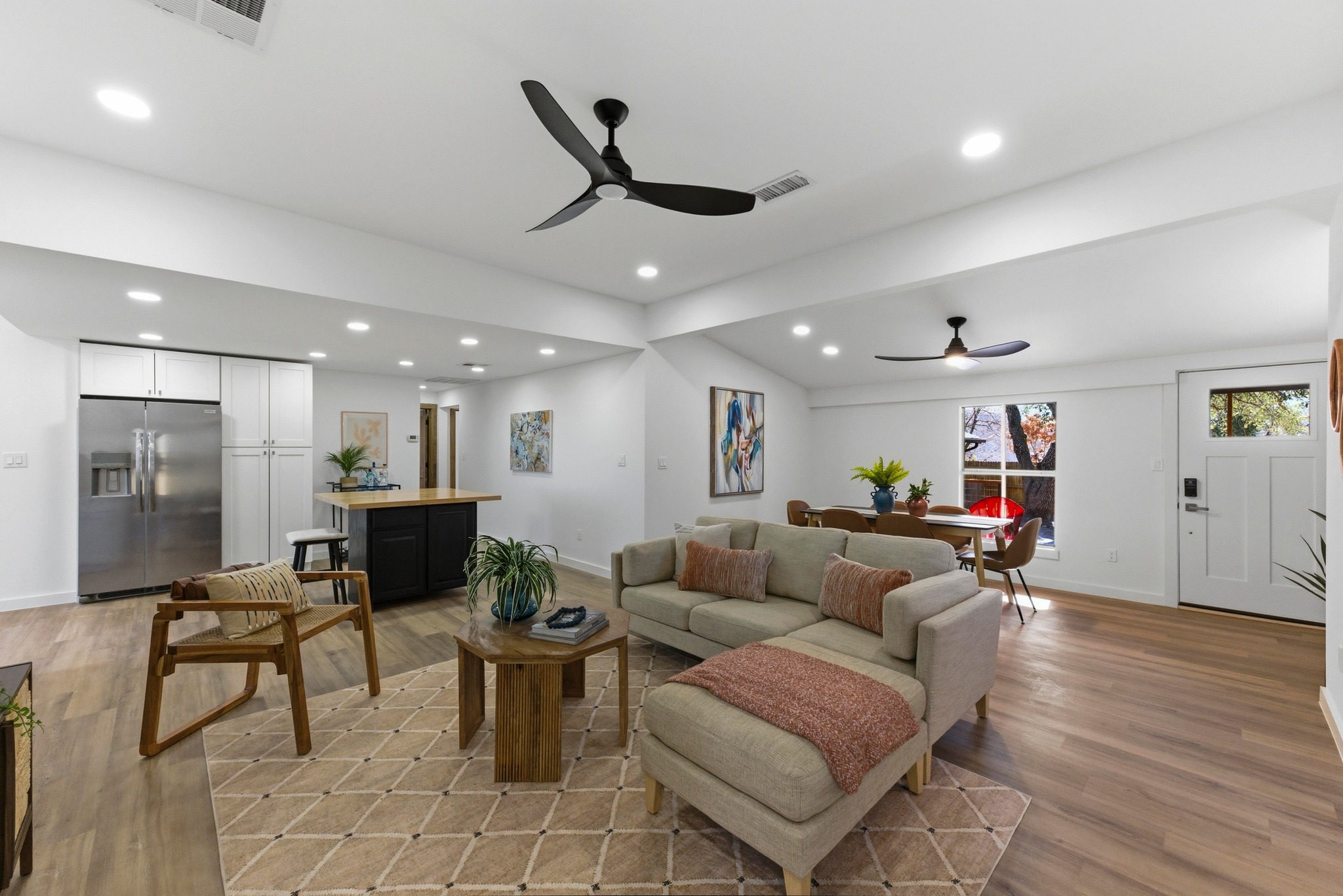 2649 Crazyhorse Pass Austin, TX 78734 - Photo 4 of 40 Living room with vaulted ceiling, ceiling fan, light wood-type flooring, and recessed lighting