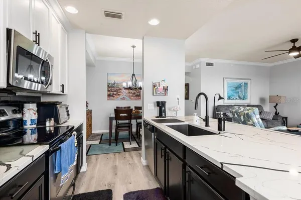 a kitchen with counter top space and stainless steel appliances