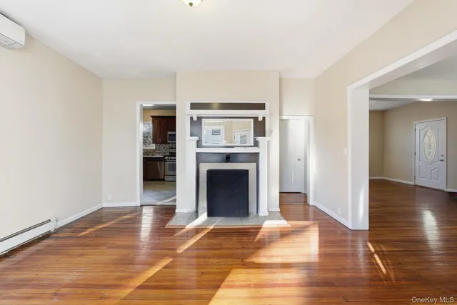 a kitchen with granite countertop a refrigerator and cabinets