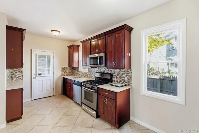 a bathroom with a sink a toilet and shower curtain