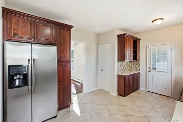 a view of staircase with white walls and windows