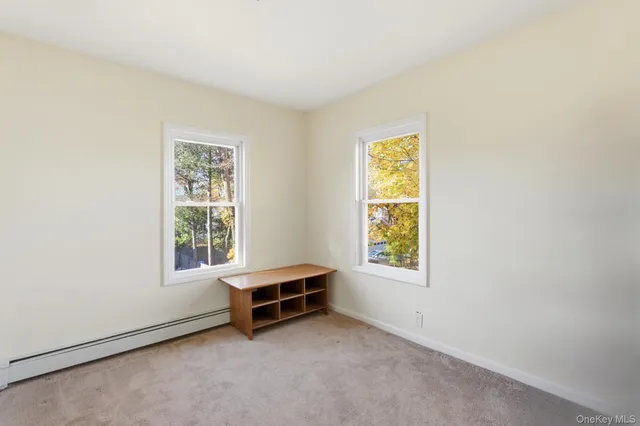 a view of entryway with hallway and stairs