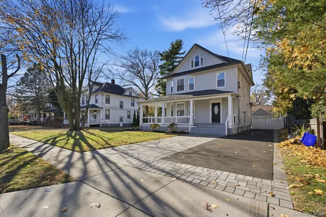 a view of a wooden house with a yard