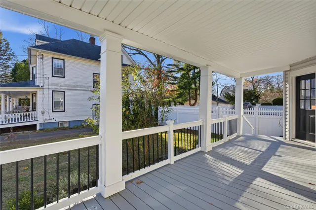 a view of entryway with wooden floor and stairs