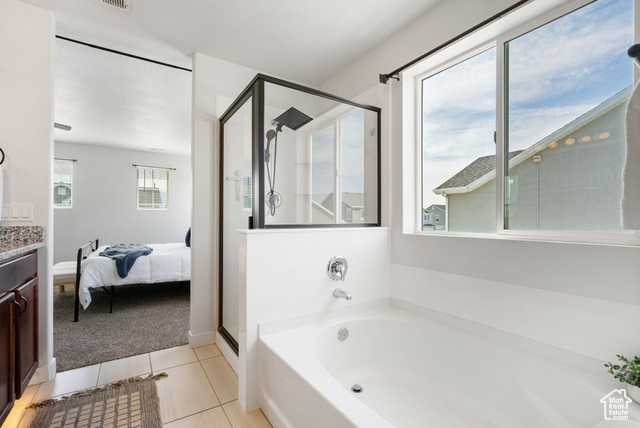 3456 South Linden Way Syracuse, UT 84075 - Photo 24 of 50 Primary en suite featuring a shower stall, a bath, vanity, tile patterned floors, and connected bathroom
