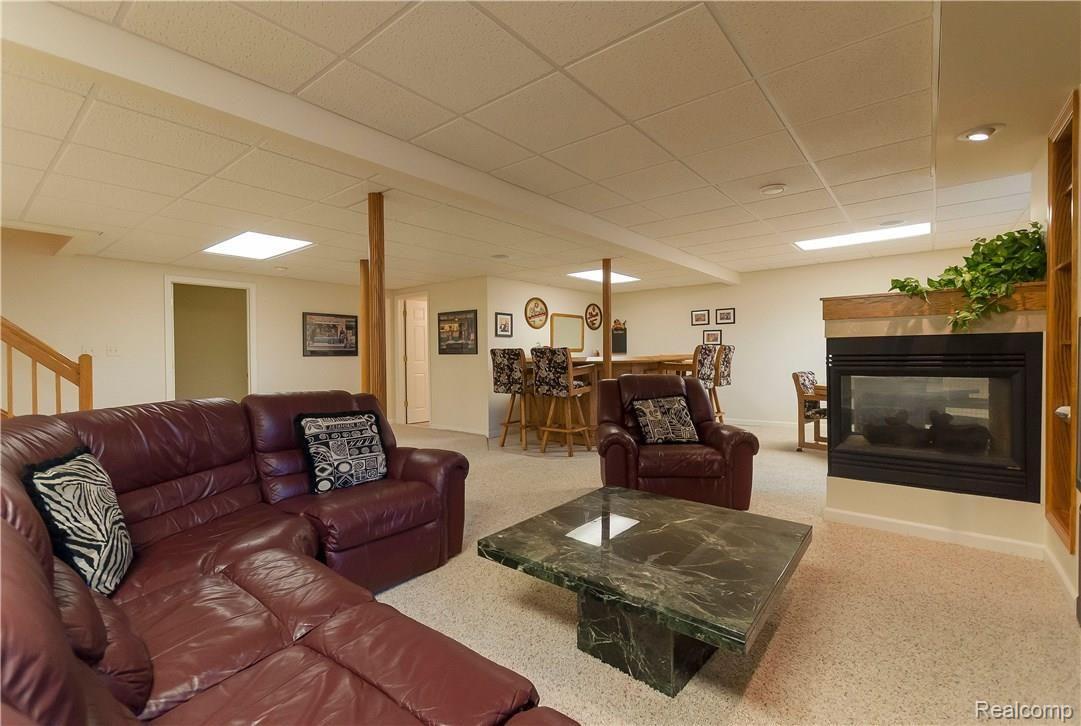 60558 Pennington Way Rochester, MI 48306 - Photo 34 of 50 Finished basement with fireplace