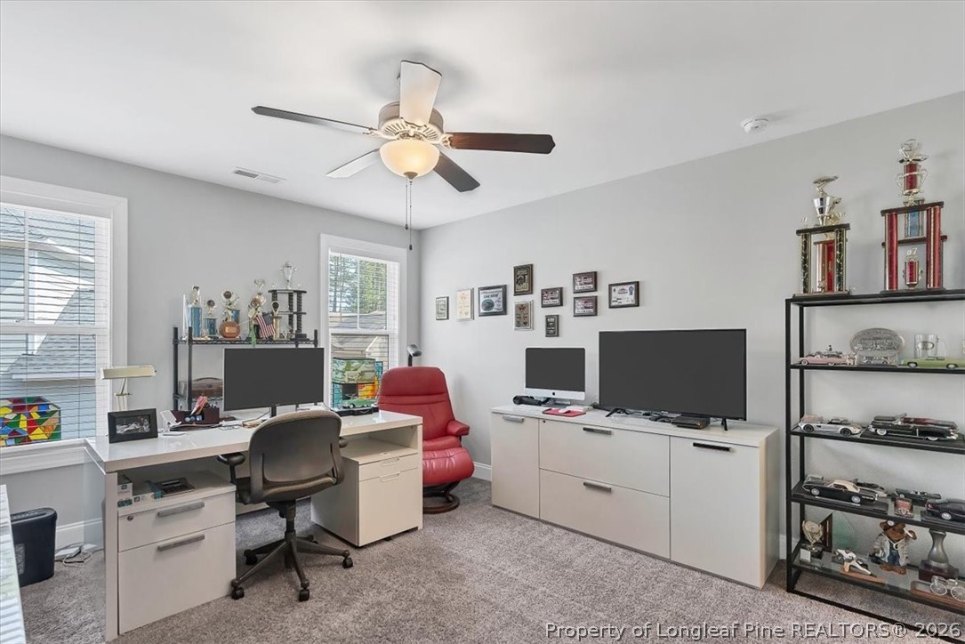 10 Heatherspring Way Spring Lake, NC 28390 - Photo 41 of 48 a view of a workspace with furniture and a window
