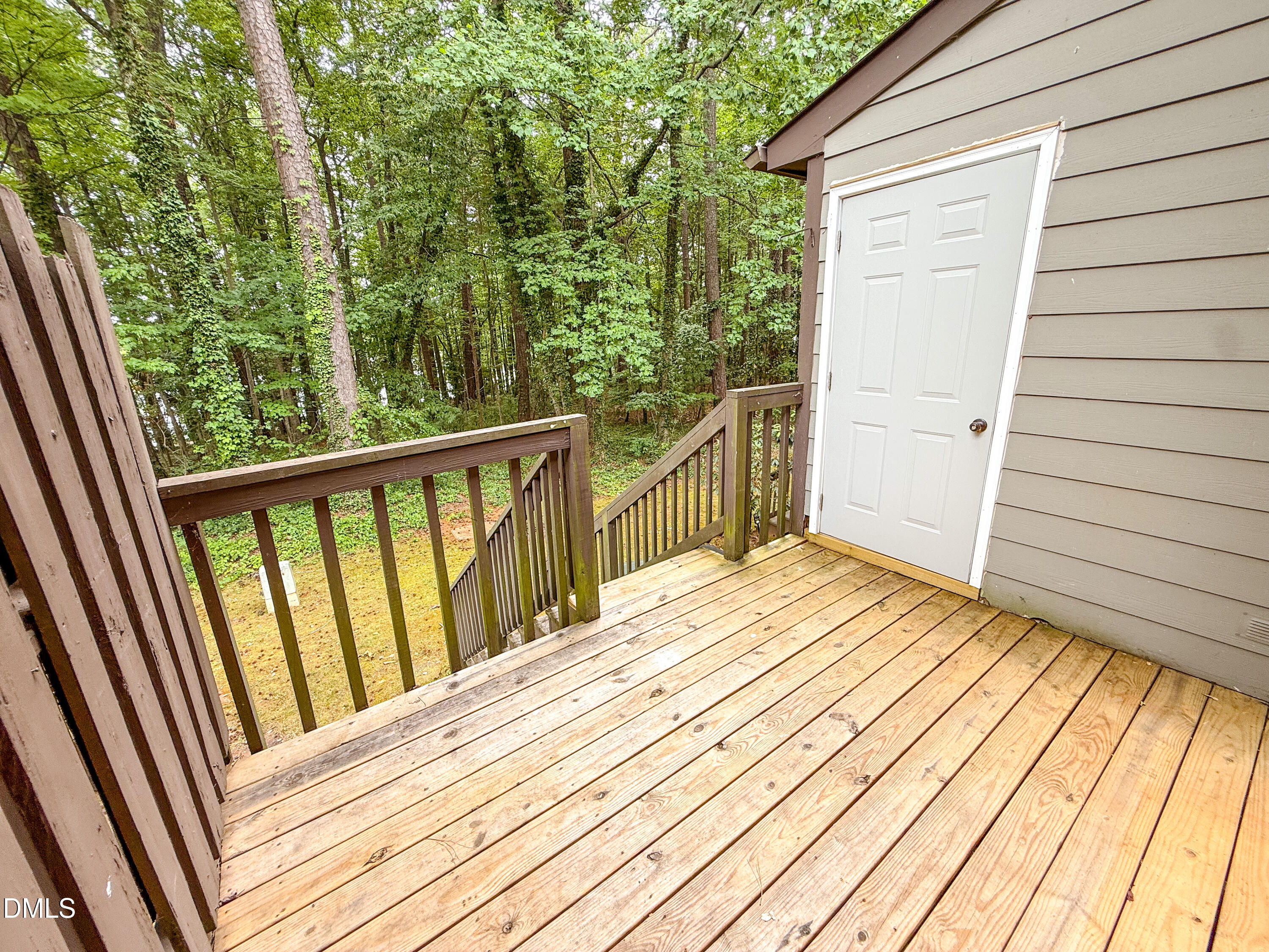 4247 The Oaks Drive Raleigh, NC 27606 - Photo 21 of 21 a view of a balcony with wooden floor