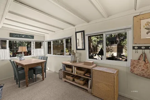 a room with furniture and large windows