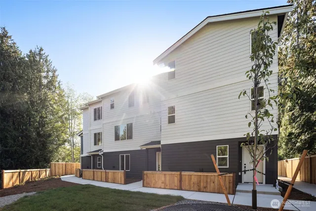 a view of house with a yard