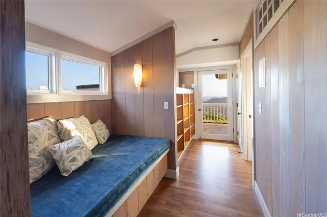 a view of bedroom with furniture and wooden floor