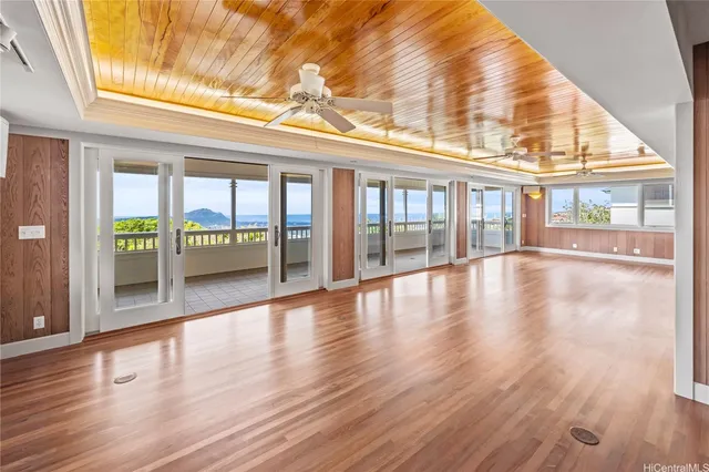 a view of an entryway with wooden floor