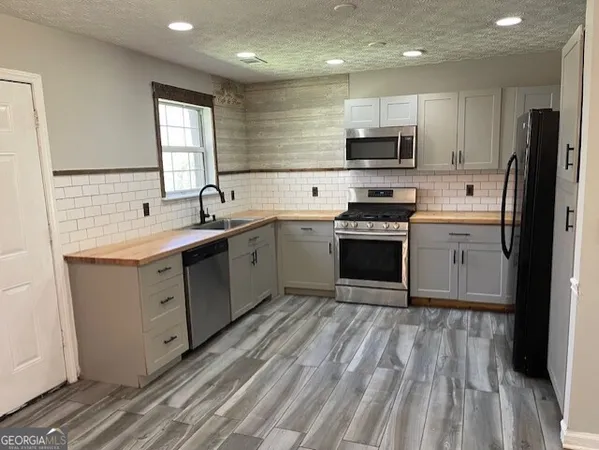 $249,000 | 440 East Country Woods Drive, Covington, GA 30016