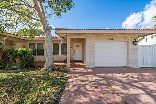 front view of a house with a trees