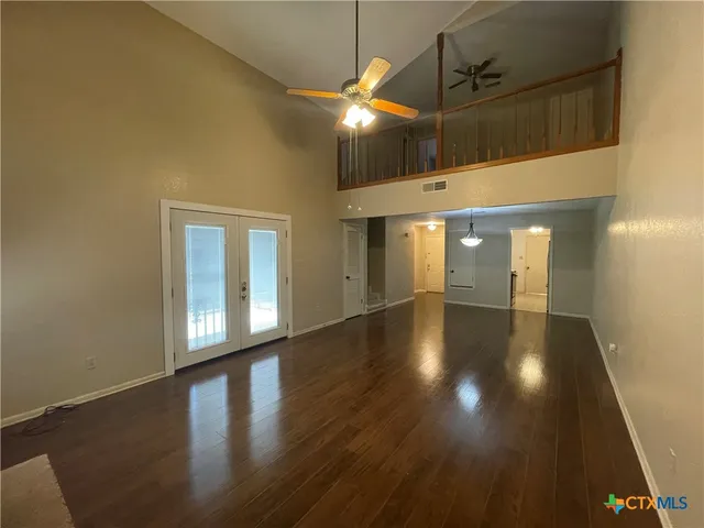 a kitchen with stainless steel appliances granite countertop a sink and a refrigerator