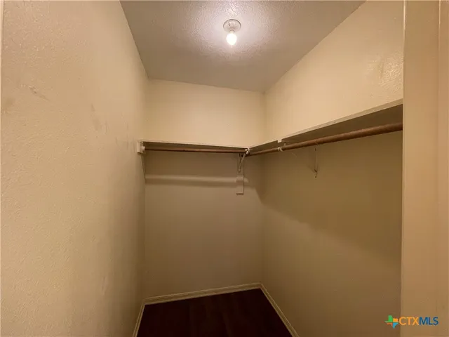 a bathroom with a sink a light fixture and a mirror