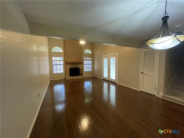 a view of a livingroom with wooden floor