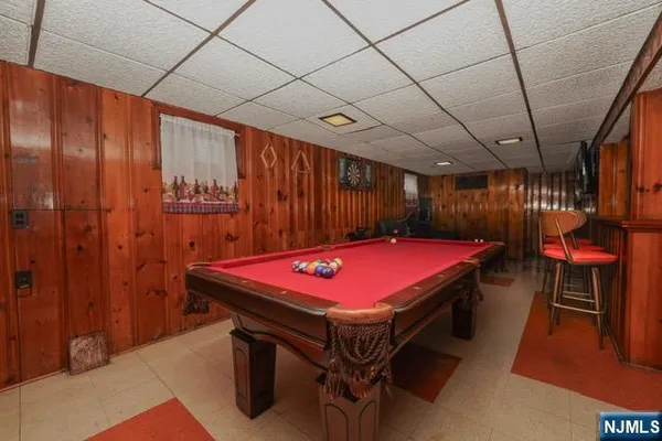 a room with furniture and pool table