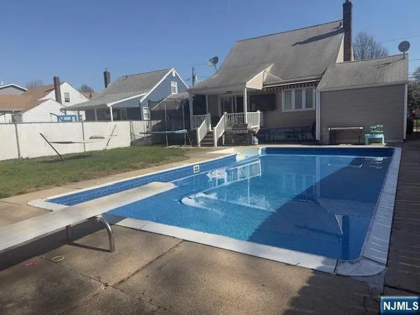 a view of a house with swimming pool