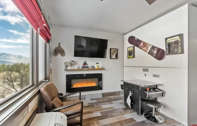 a living room with furniture and a flat screen tv