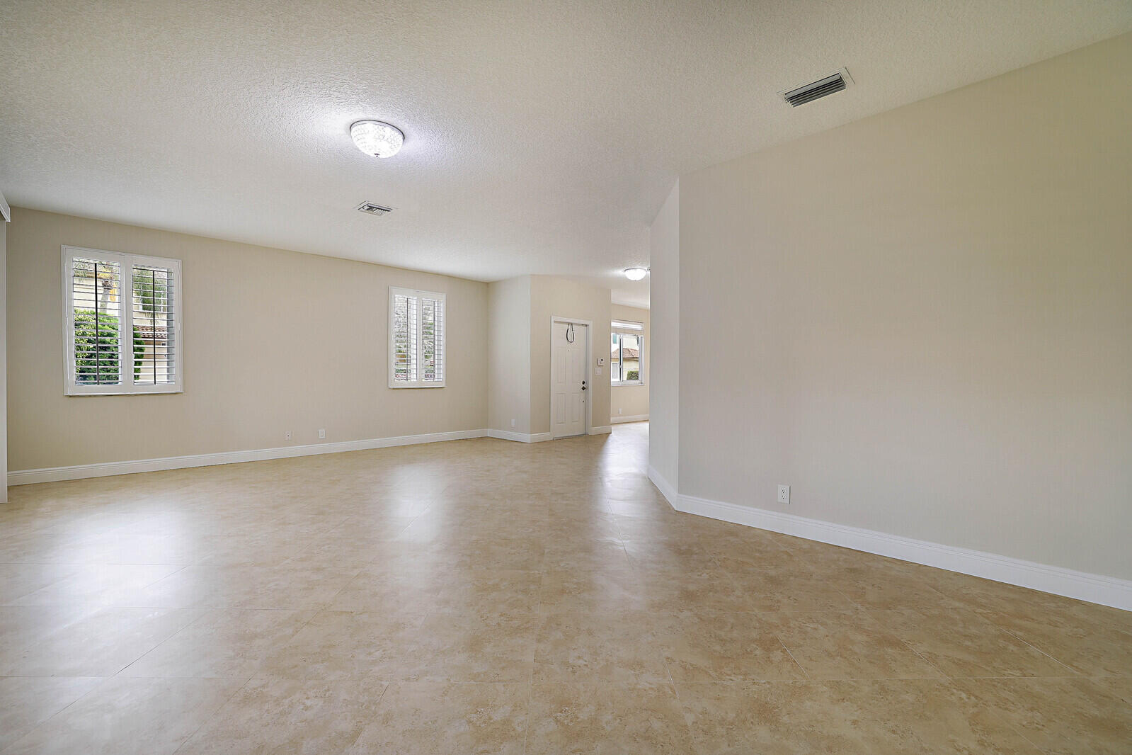 6819 Via Regina Boca Raton, FL 33433 - Photo 12 of 39 an empty room with windows