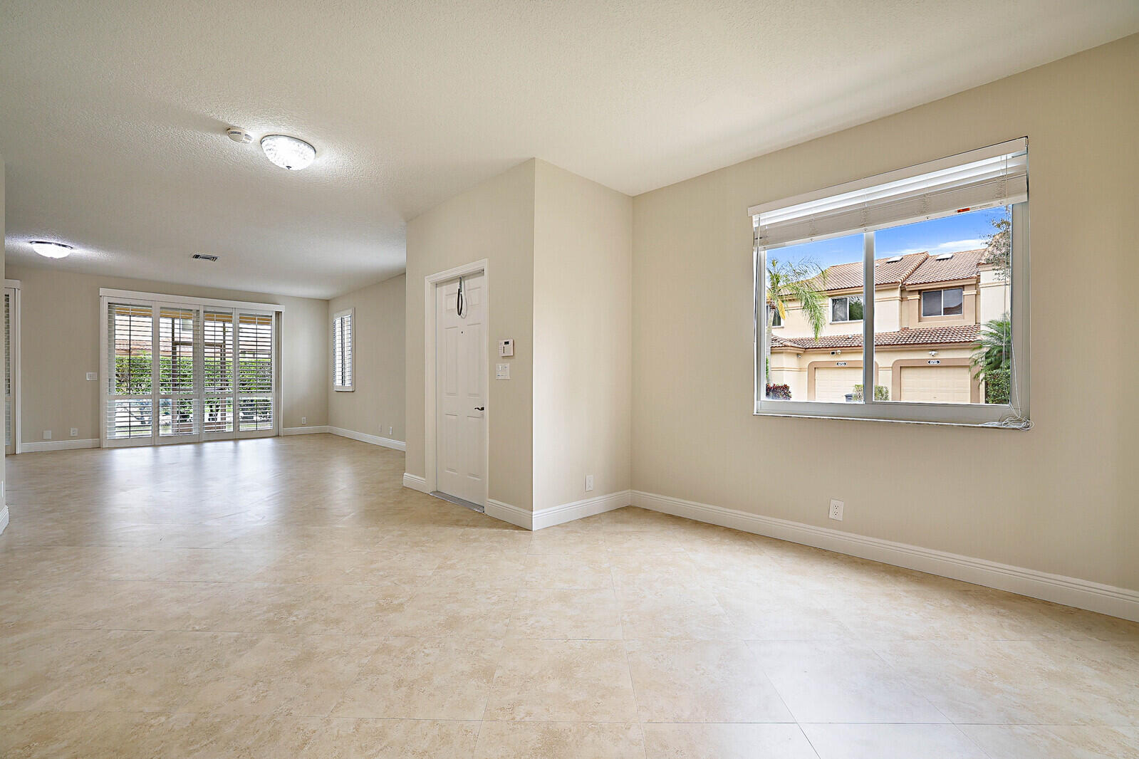 6819 Via Regina Boca Raton, FL 33433 - Photo 13 of 39 a view of an empty room with a window
