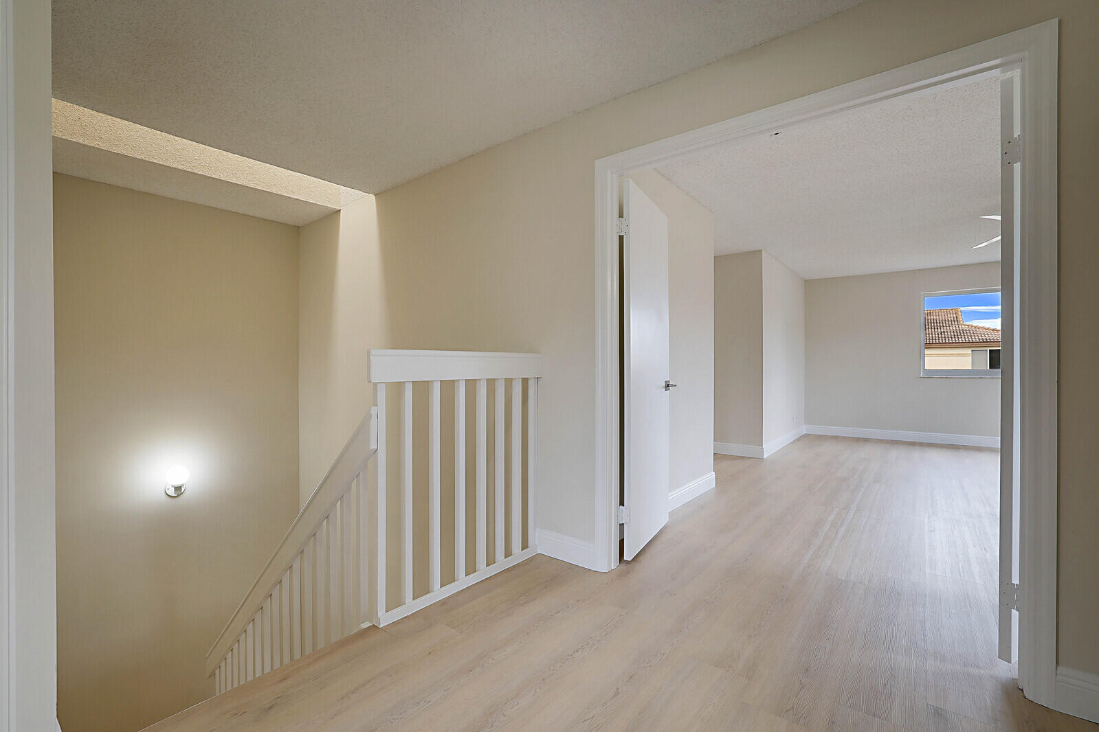 6819 Via Regina Boca Raton, FL 33433 - Photo 25 of 39 a view of a hallway and wooden floor