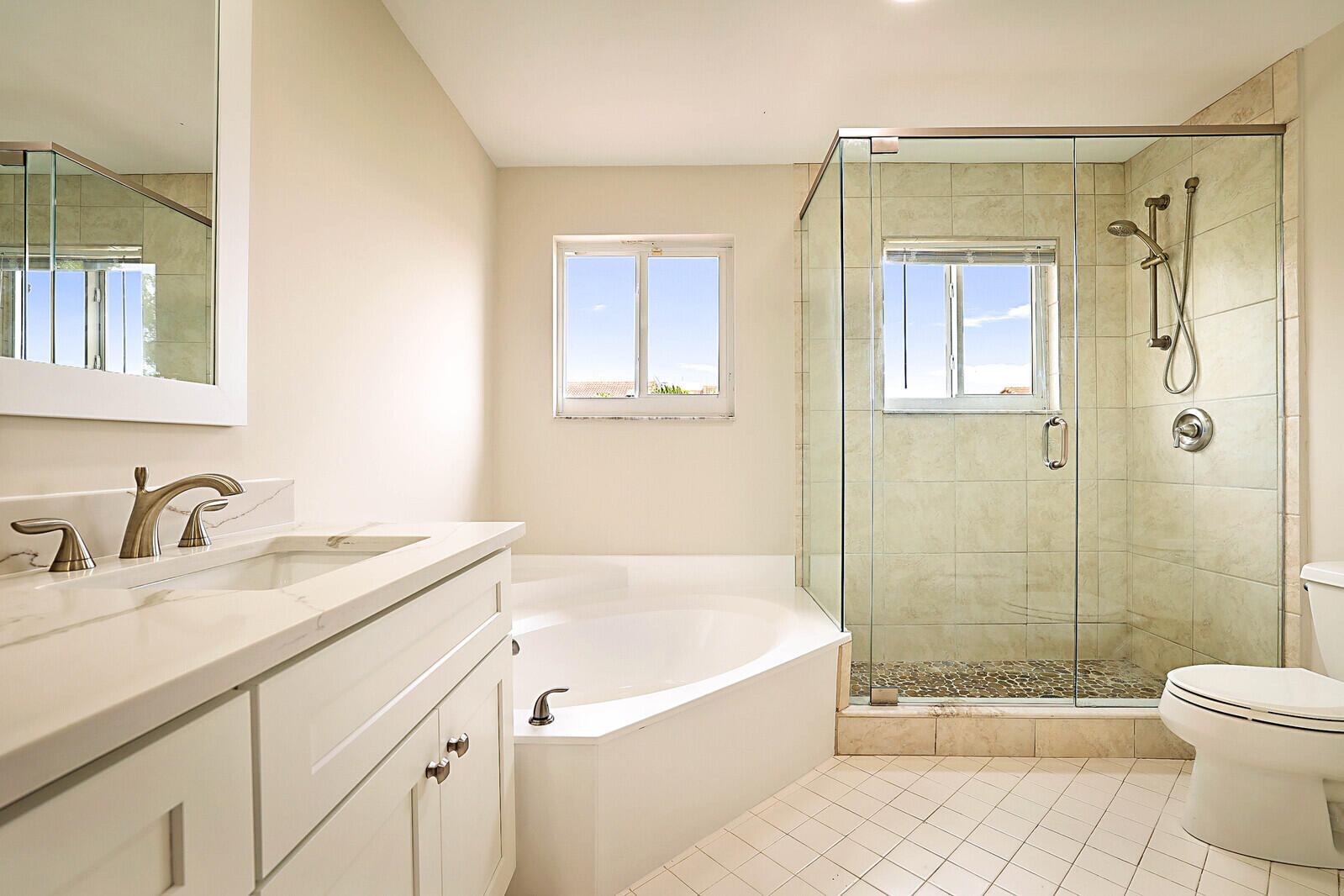 6819 Via Regina Boca Raton, FL 33433 - Photo 31 of 39 a bathroom with a granite countertop tub sink toilet and shower