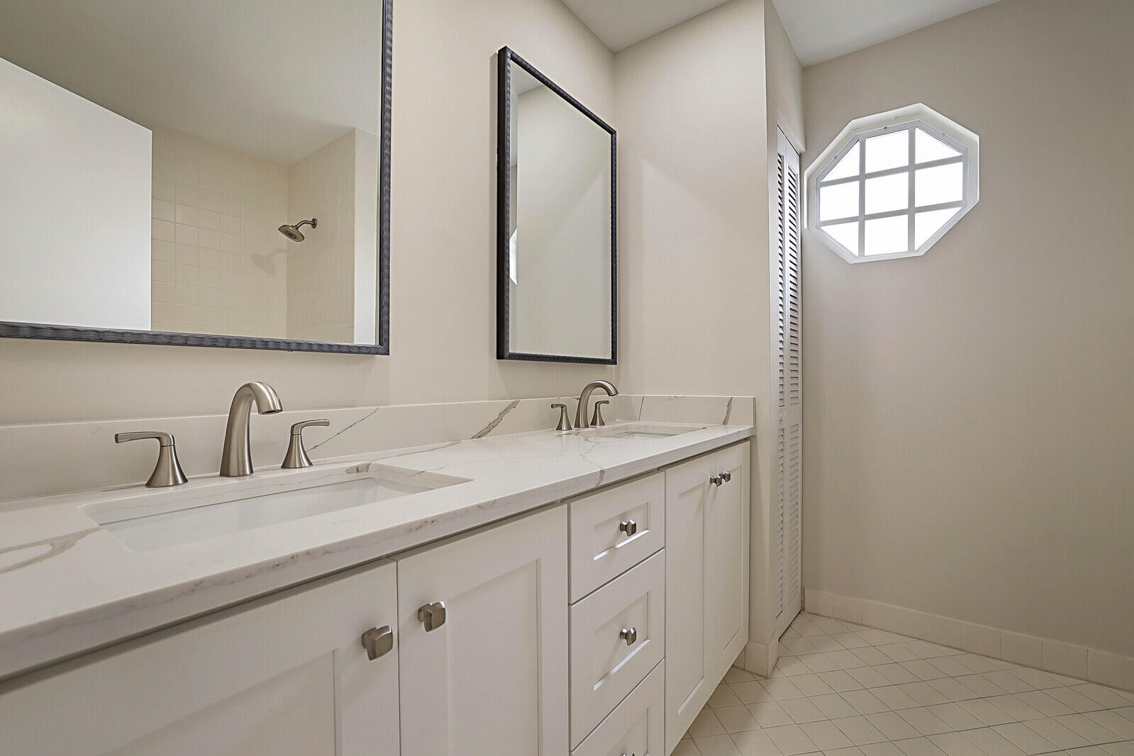 6819 Via Regina Boca Raton, FL 33433 - Photo 34 of 39 a bathroom with 2 sink and a mirror