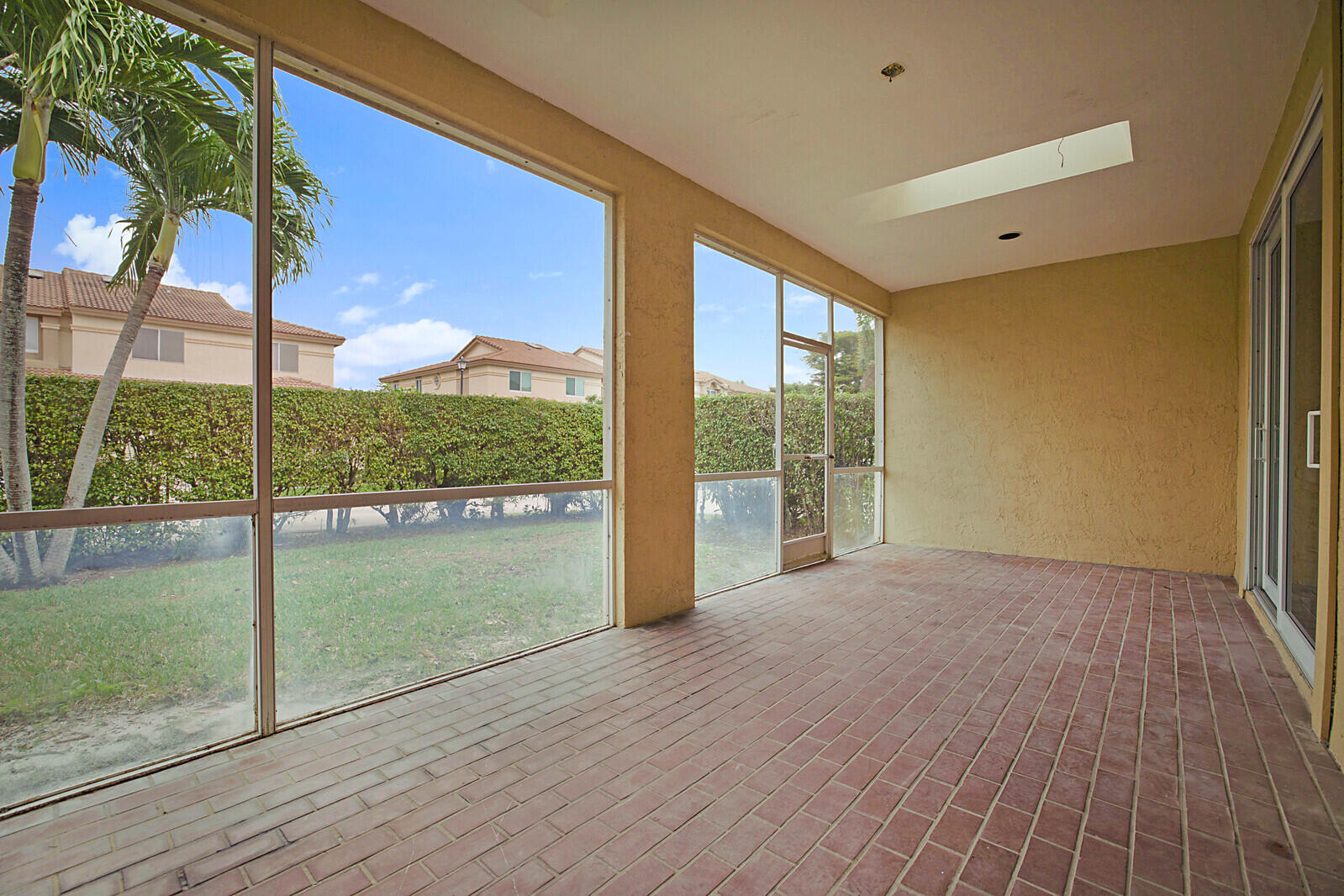 6819 Via Regina Boca Raton, FL 33433 - Photo 36 of 39 a view of an empty room with glass door and balcony