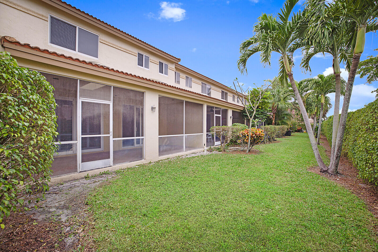 6819 Via Regina Boca Raton, FL 33433 - Photo 37 of 39 a view of a house with a yard and garden