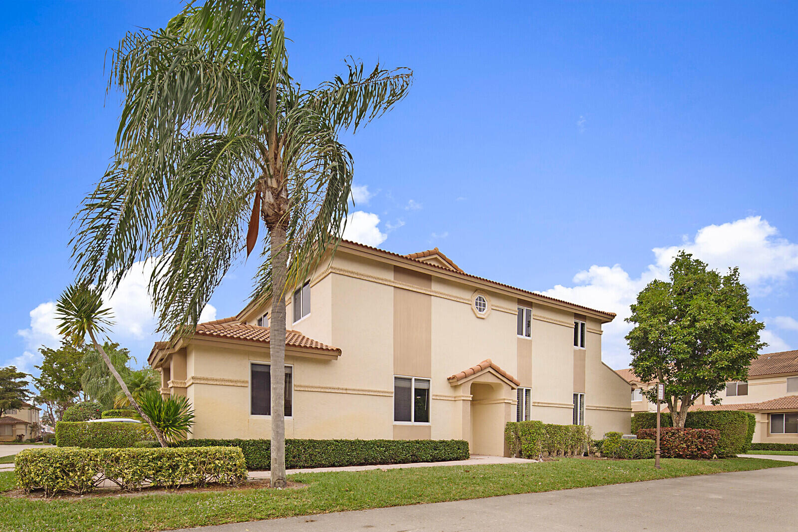 6819 Via Regina Boca Raton, FL 33433 - Photo 4 of 39 a front view of a house with a yard