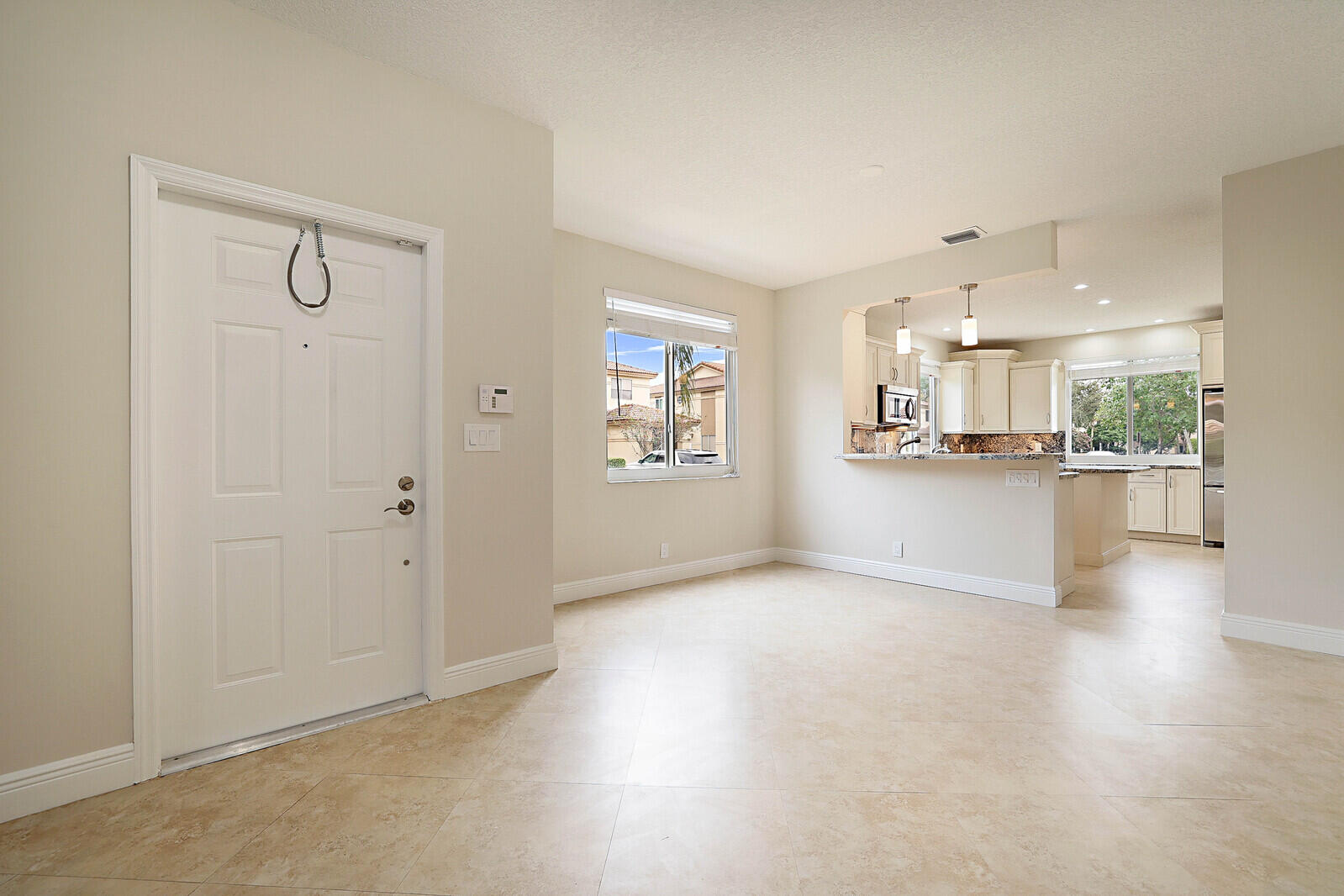 6819 Via Regina Boca Raton, FL 33433 - Photo 8 of 39 a view of a kitchen with refrigerator and window