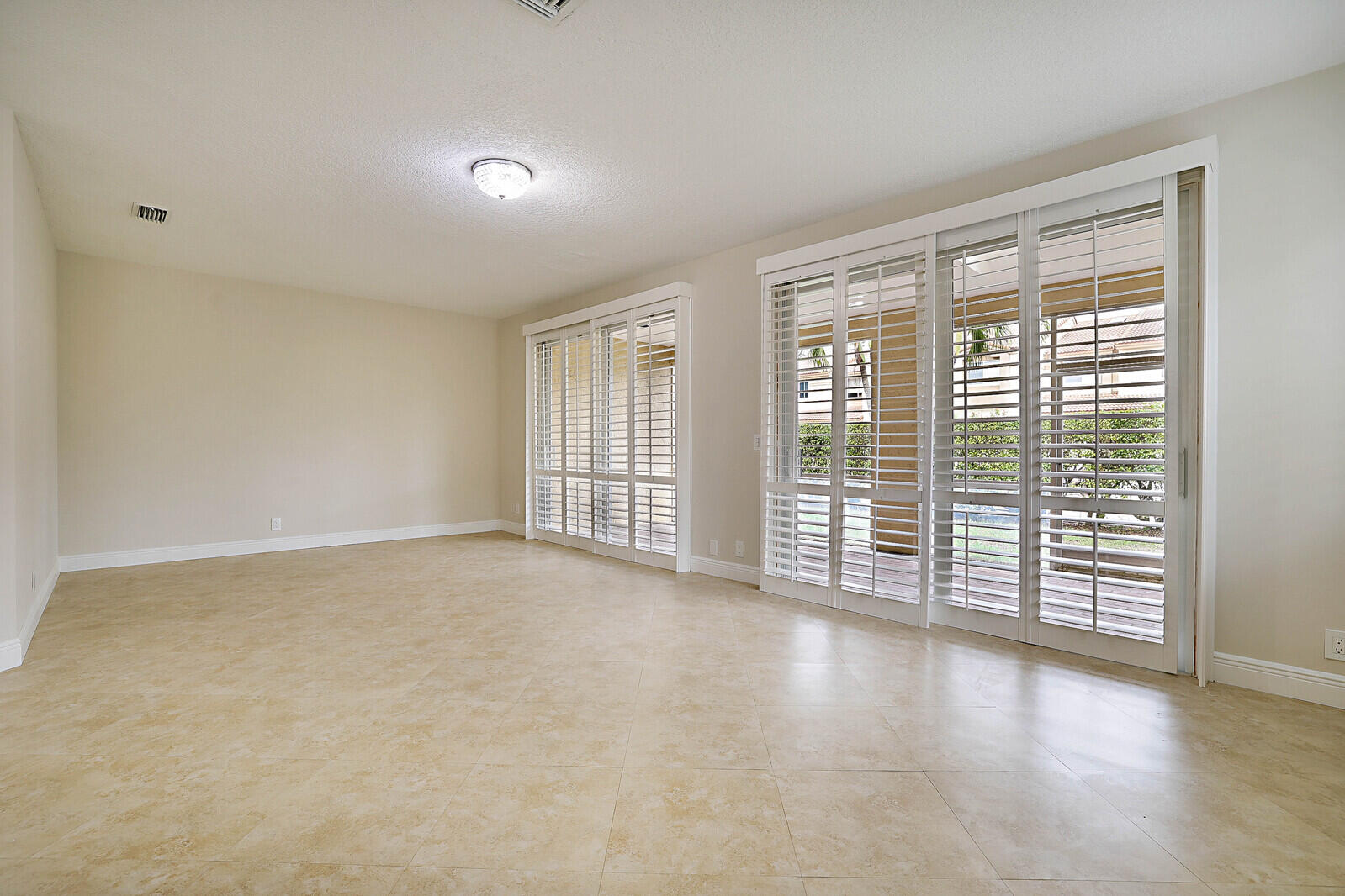 6819 Via Regina Boca Raton, FL 33433 - Photo 9 of 39 a view of an empty room with a window