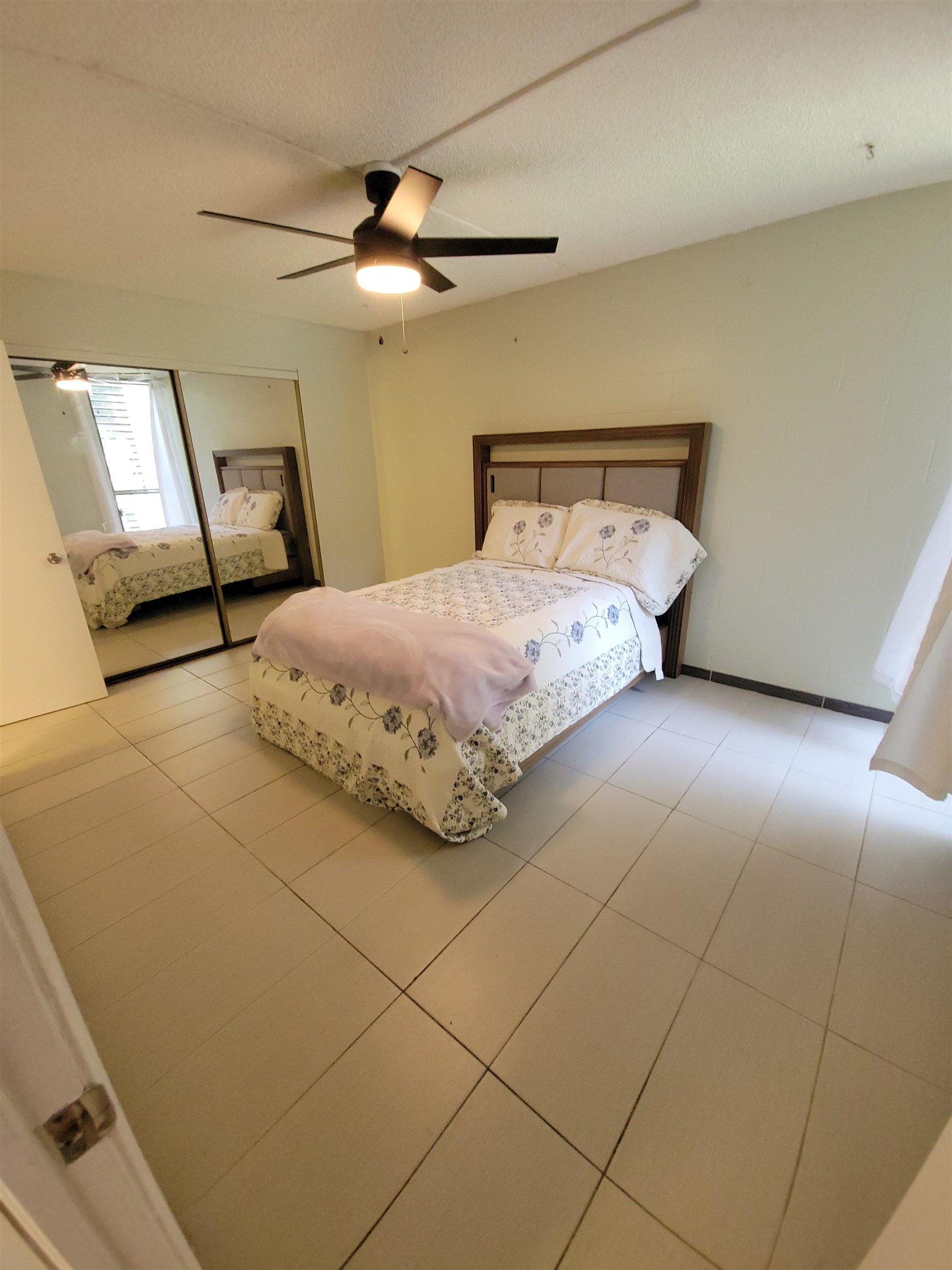 111 Kahului Beach Road, Unit B213 Kahului, HI 96732 - Photo 12 of 28 a bedroom with a bed and window