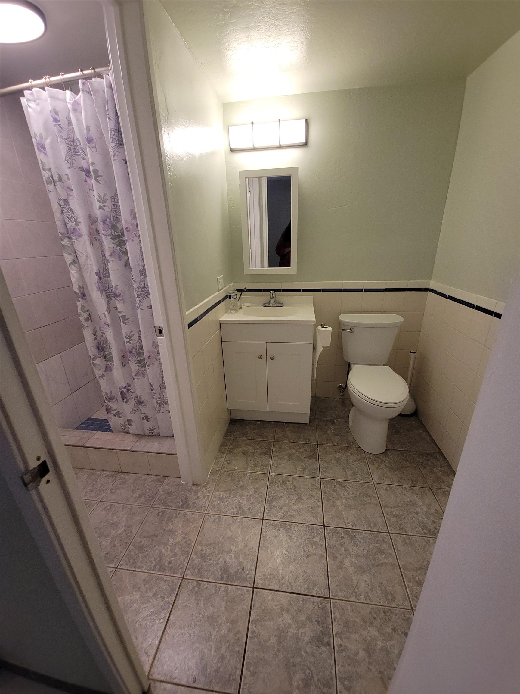 111 Kahului Beach Road, Unit B213 Kahului, HI 96732 - Photo 15 of 28 a bathroom with a sink a toilet and mirror