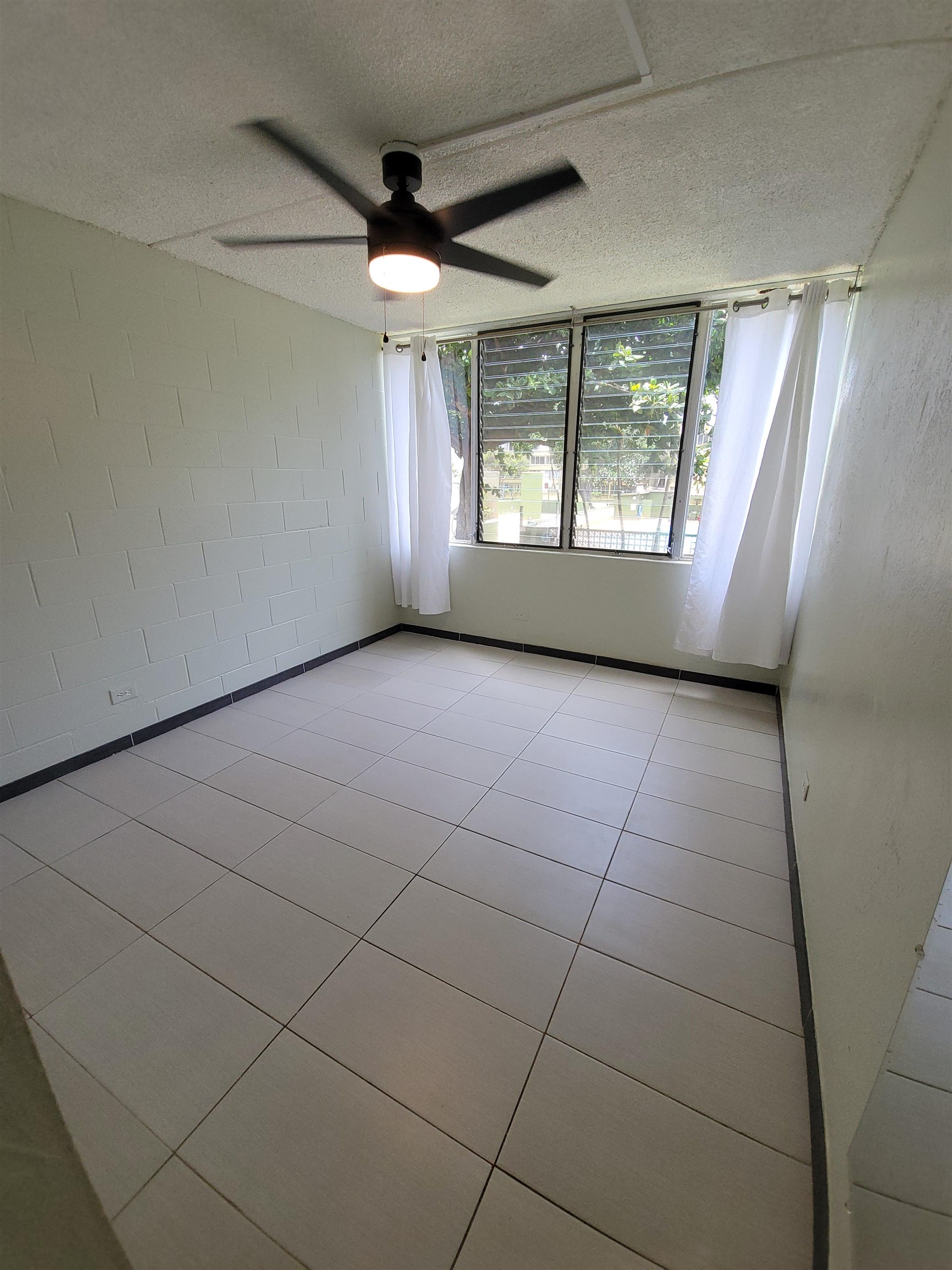 111 Kahului Beach Road, Unit B213 Kahului, HI 96732 - Photo 17 of 28 a view of an empty room with a window