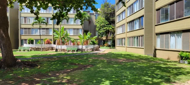 a view of parking garage with cars parked